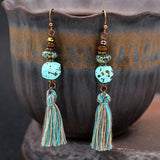 Fashion hollow carved alloy tassel earrings