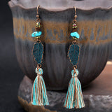 Fashion hollow carved alloy tassel earrings