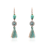 Fashion hollow carved alloy tassel earrings