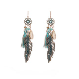 Fashion hollow carved alloy tassel earrings