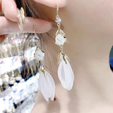Long fringed opal white petal earrings