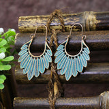 Wind leaf round openwork turquoise earrings