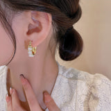 U-shaped pearl earrings