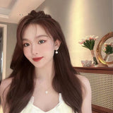 Pearl love earrings