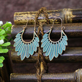 Irregular leaves hollowed out turquoise earrings