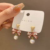 Coffee-colored bow temperament pearl earrings