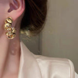 S925 silver needle niche design twisted metal earrings