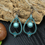 Irregular leaves hollowed out turquoise earrings