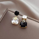 S925 silver needle clover black and white asymmetric earrings
