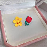 Golden-scented asymmetrical flower earrings