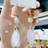 Long fringed opal white petal earrings