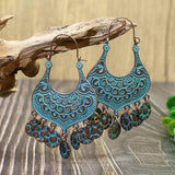 Irregular leaves hollowed out turquoise earrings
