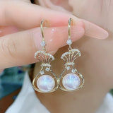 Red purse pearl earrings