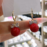 Zircon bow pearl earrings