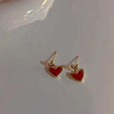 Simple and small red love earrings