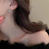 Silver needle with diamond star tassel earrings