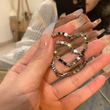 Broken silver love earrings