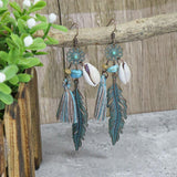 Irregular leaves hollowed out turquoise earrings