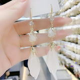 Long fringed opal white petal earrings