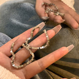 Broken silver love earrings