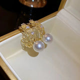 S925 silver needle simple inlaid hollow pearl earrings