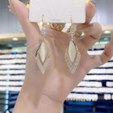 Geometric long diamond earrings